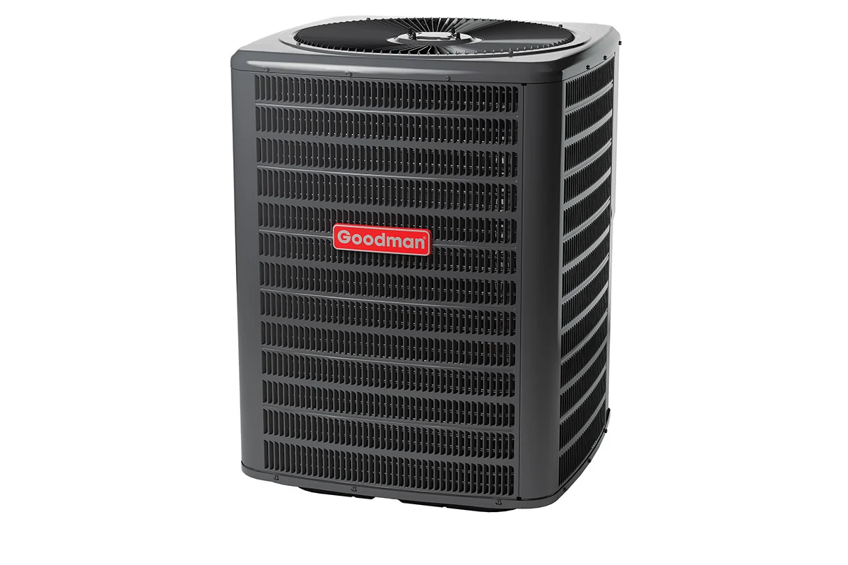HVAC technician servicing a Goodman residential air conditioning system